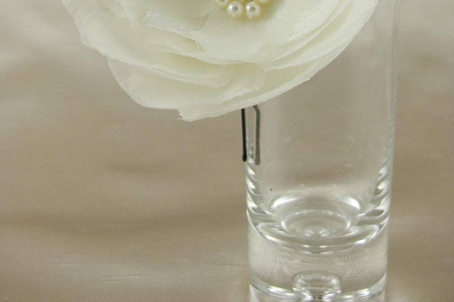 Silk dupioni and silk organza flower hair accessory with Swarovski pearl center.