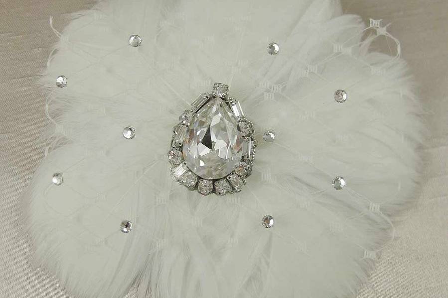 Feather flower hair clip with a vintage inspired Swarovski pear shaped rhinestone center and russian netting