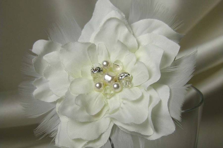 Silk delphinium with feathers and a Swarovski crystal, pearl and rhinestone center