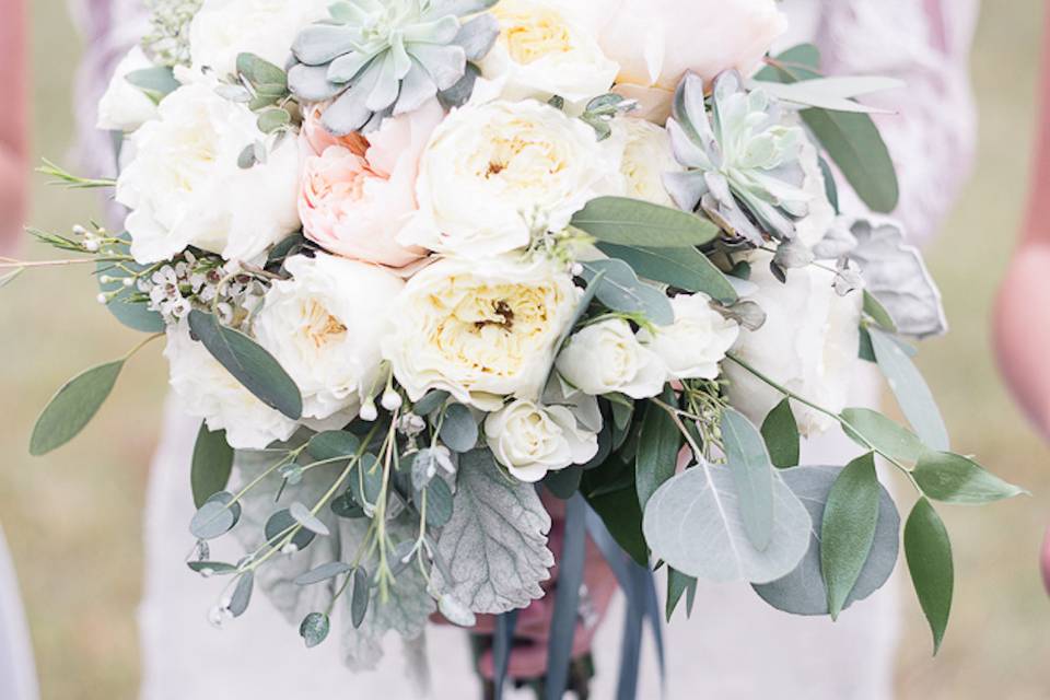 Stunning bridal bouquet with garden roses, succulents, eucalyptus & dusty miller!