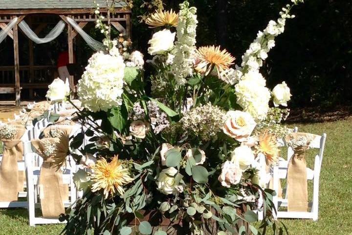 Gorgeous whiskey barrel arrangement with hydrangeas, eucalyptus delpheniums, stock, mums and roses!