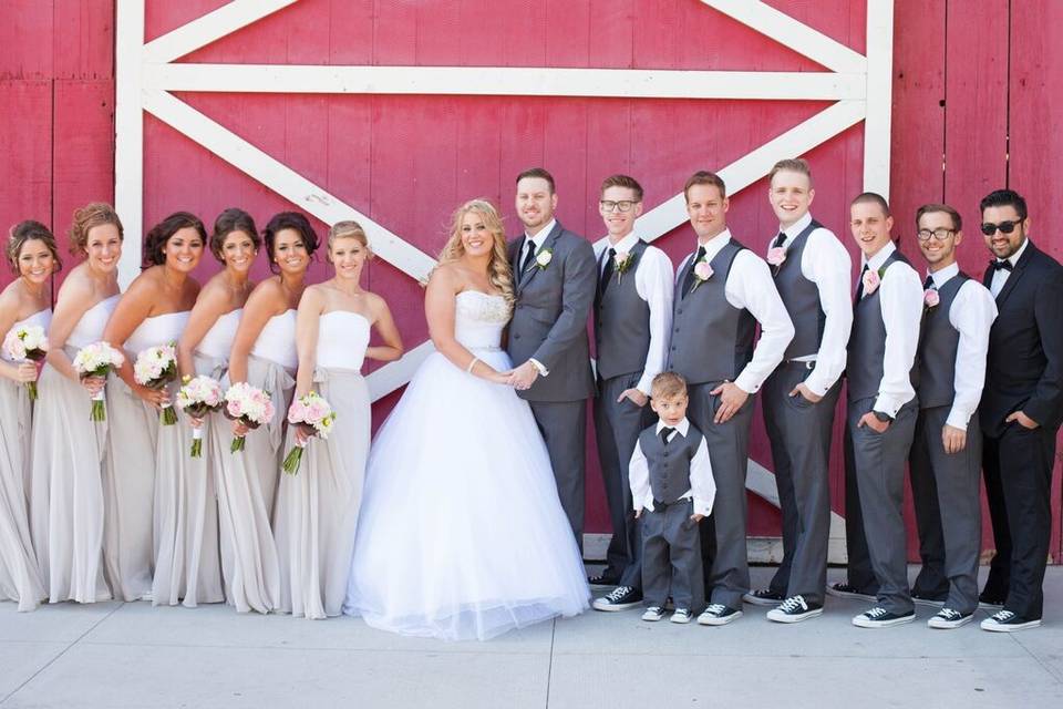 Katie & Terrence with their wedding party in front of the Camarillo Ranch Barn.