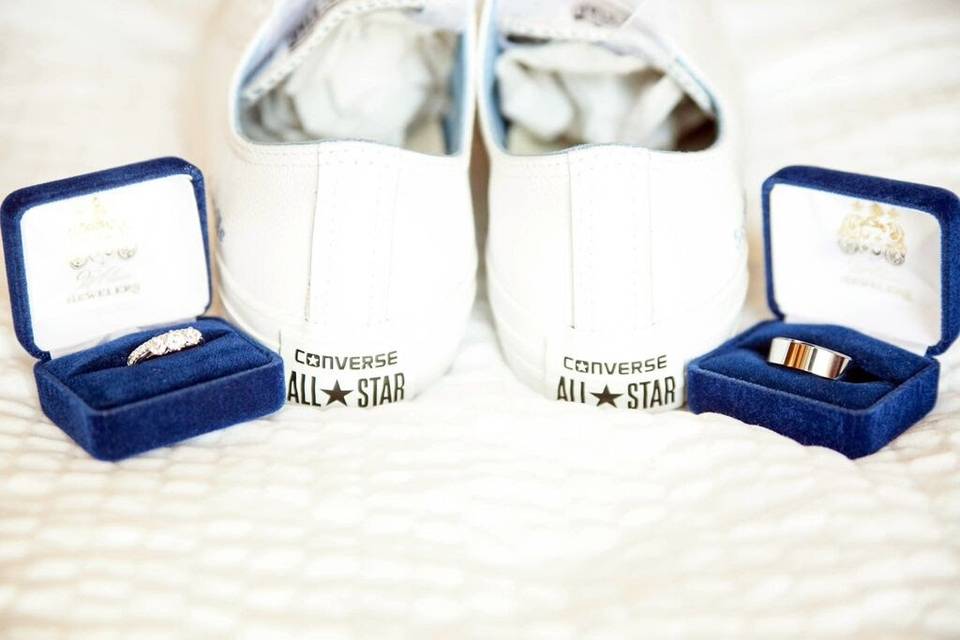 Katie & Terrence's rings and cute white converse shoes.