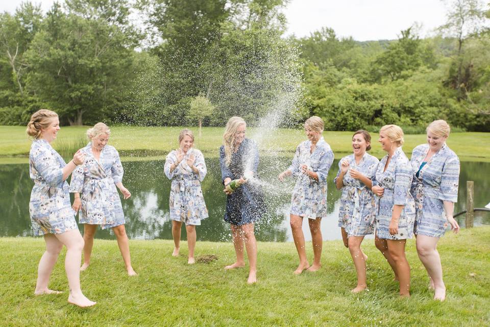 Valerie michelle photography. Baltimore maryland wedding photographer. Bridesmaids popping champagne.