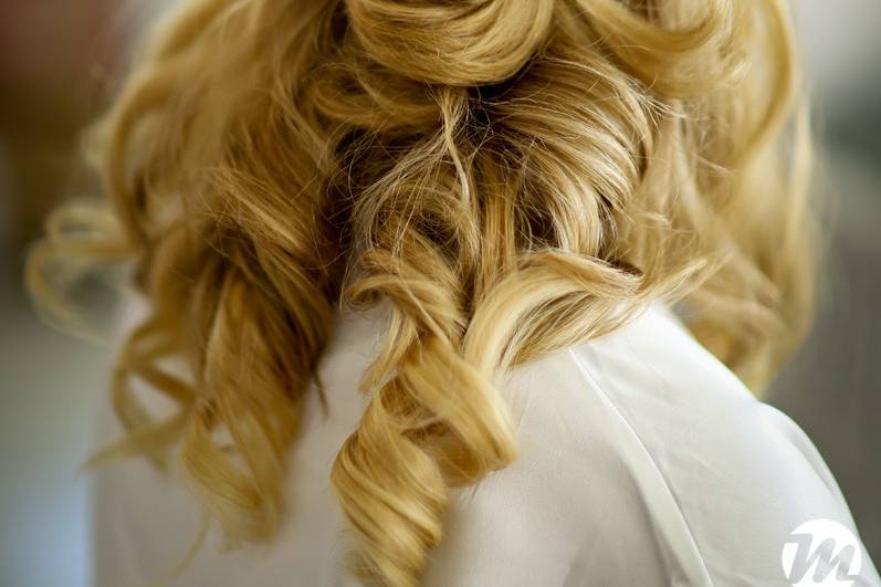 Braided bridal half up hairstyle with accessory