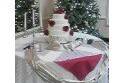 Four tiers with red roses rondomly placed. Perfect for that christmas season matrimony.