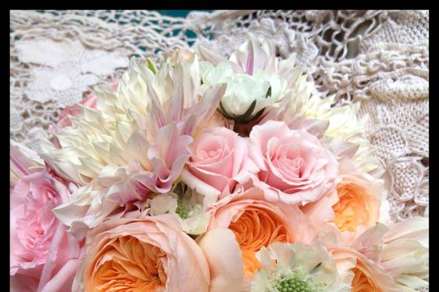 Playful and bright bouquet with coral & red dahlias, snapdragons, hot pink crested celosia and purple celosia
