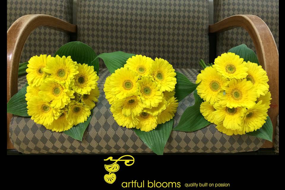 Modern, timeless design of canary yellow gerberas with leaf collars