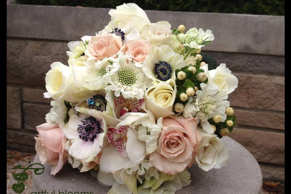 Beautiful, charming modern vintage style bouquet with white scabiosa, hypericum, anenomes, garden roses, cymbidium and pink tea roses