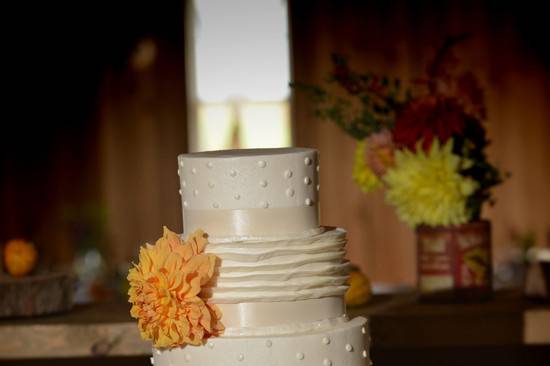 Wedding cake with a yellow flower