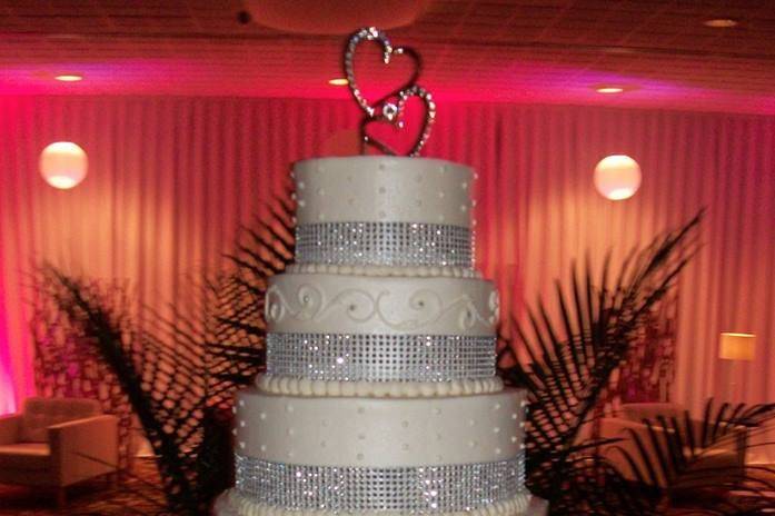 White wedding cake with silver ribbon