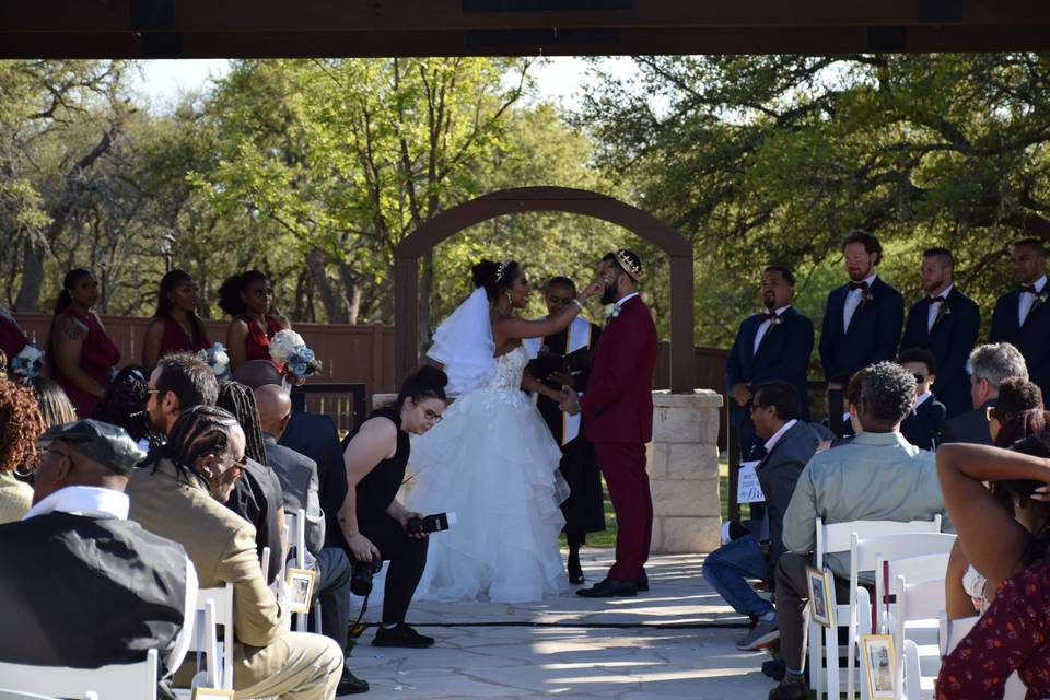 Bride wipes groom's tears