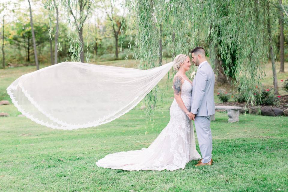 Bride and groom veil toss