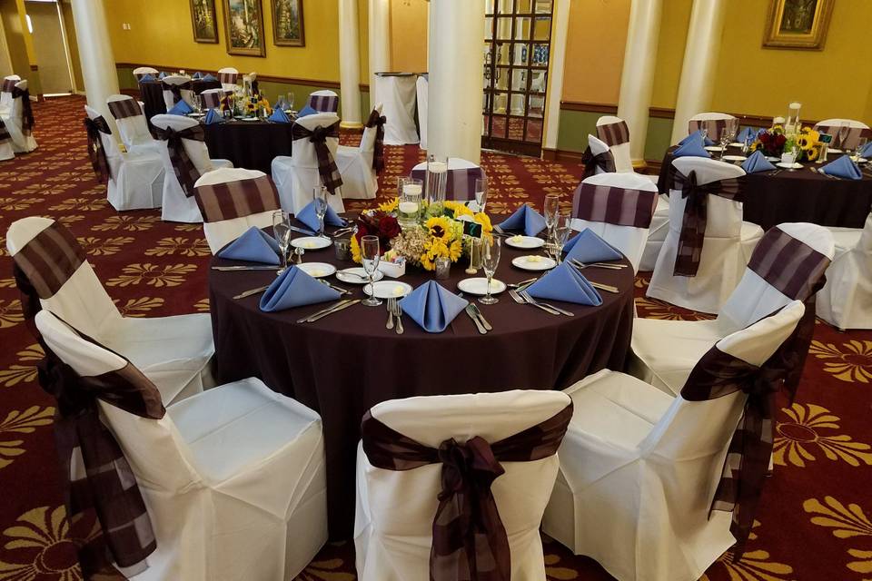 Round table setup with yellow flowers