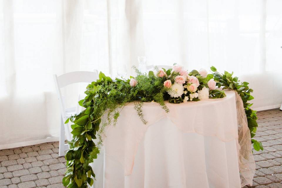 Sweetheart Table- Ceremony Garland Repurposed
Floral by A Floral Affair
Photo by Harmony Hilderbrand