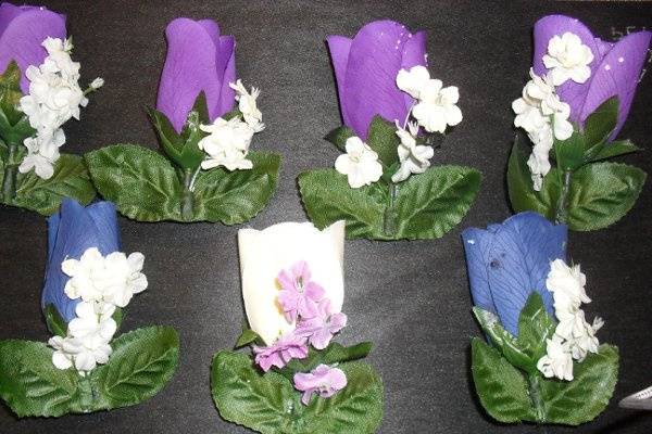 wedding 1/11/2011
Seven boutonnieres
4 purple for groomsmen
2 blue for fathers
1 ivory for groom