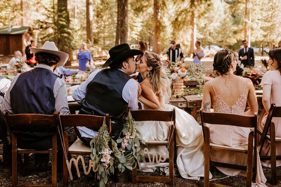 Bride and groom kissing at reception