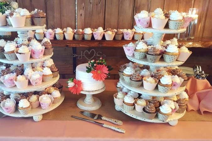 Wedding cake between cupcake towers