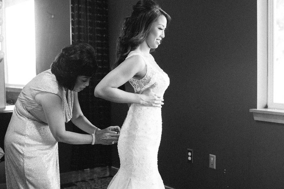 Bride fitting her gown