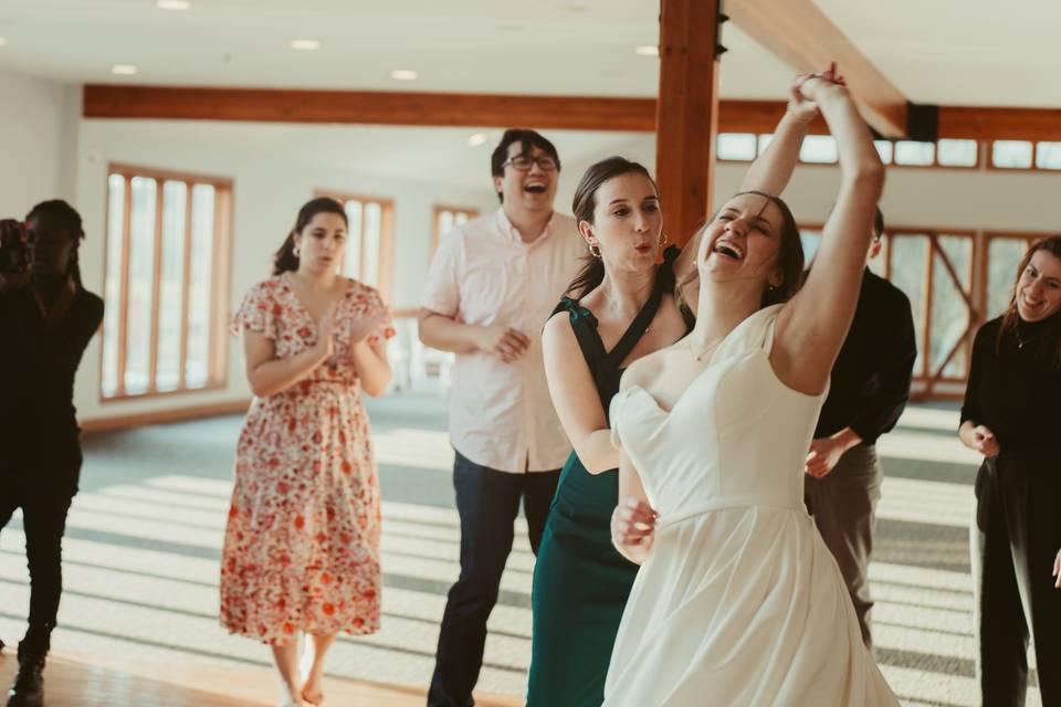 Bride dancing with friends