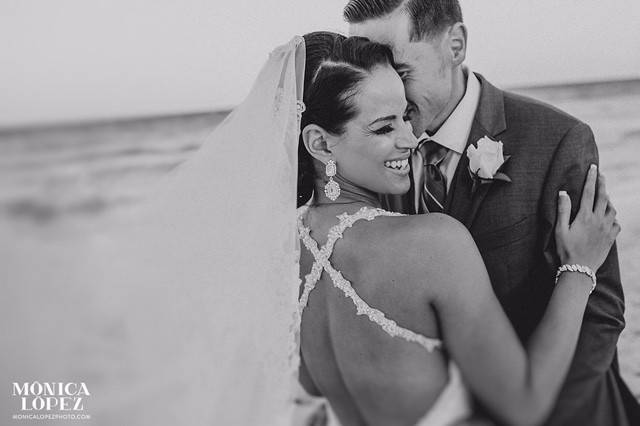 Groom kissing his bride