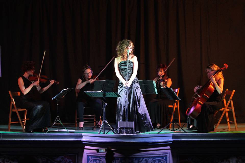 String quartet and pop singer performing at a corporate event, Milan