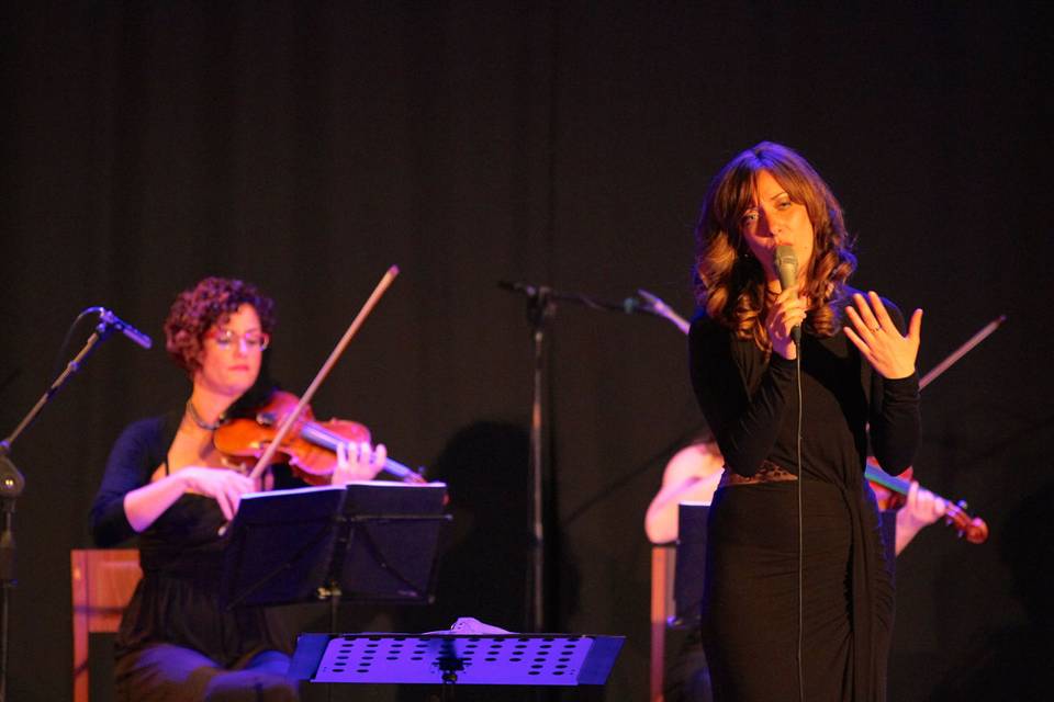 String quartet and pop singer performing at a corporate event, Milan