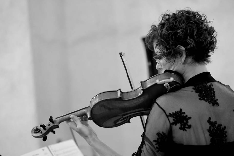 Wedding violinist performing during a church ceremony, Sestri Levante