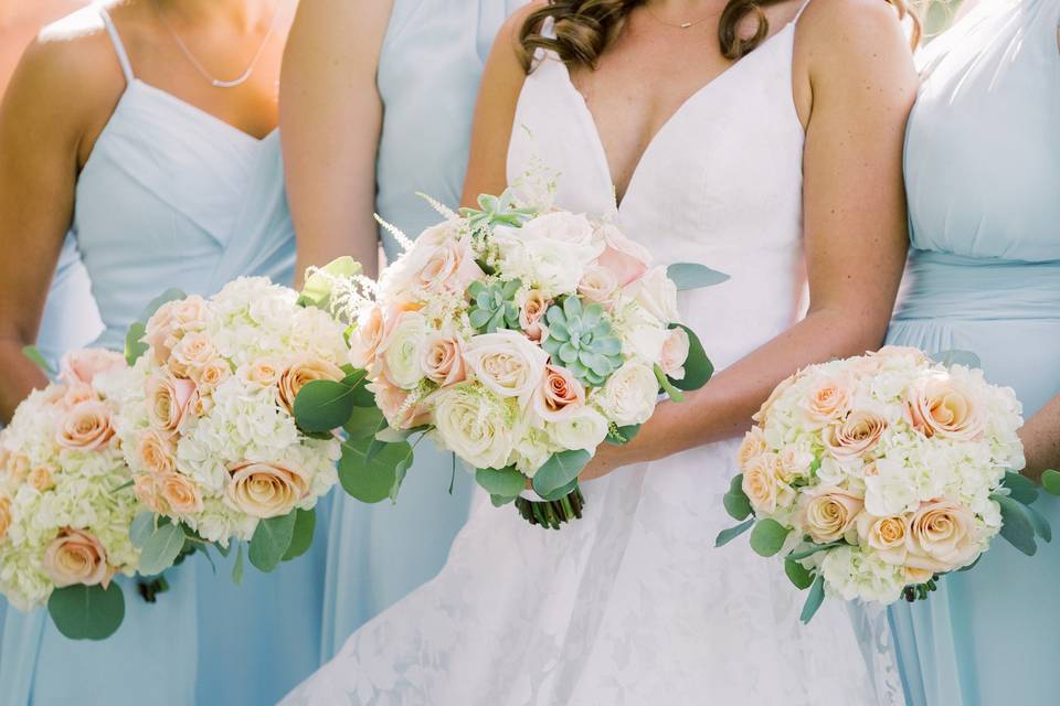 Bride and bridesmaids with bouquets