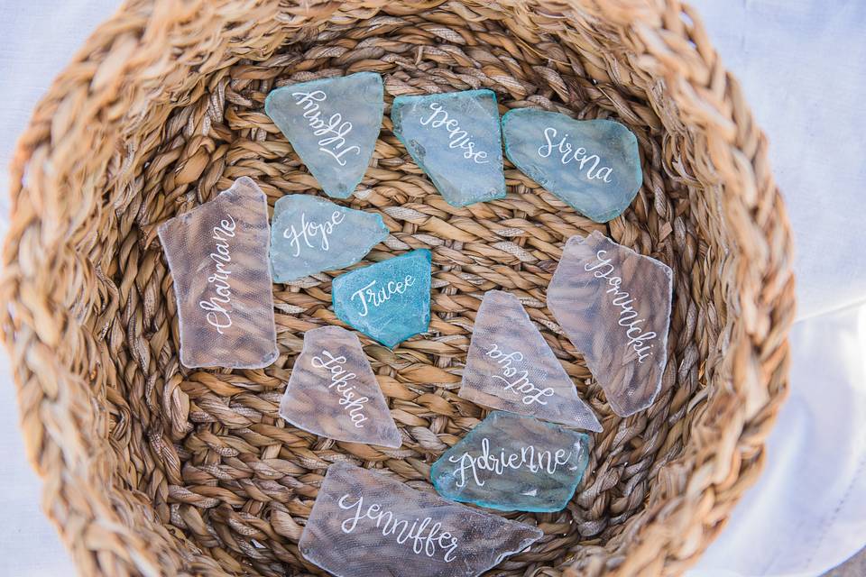 The bride elected to use pieces of sea glass for her guests' place cards. Each piece was lovingly calligraphed with the guest's first name.