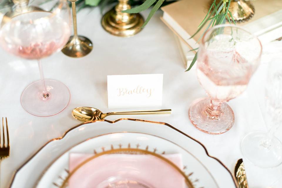 Gold calligraphy place cards decorated each guest's place setting.