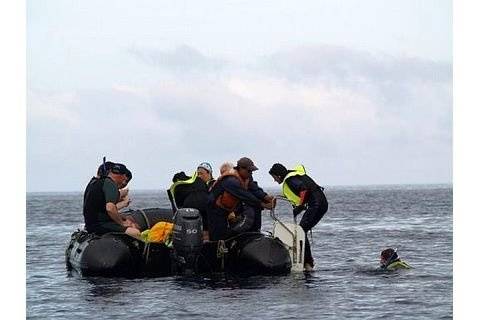 Galapagos Islands panga picking up tired snorkelers