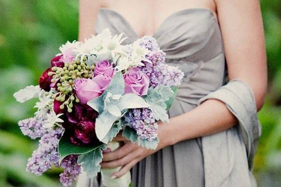 Member of the wedding party with bouquet