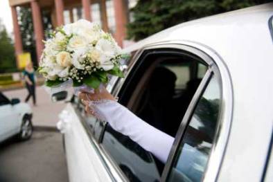 Wedding bouquet and car
