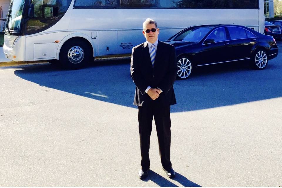 By the coach and car