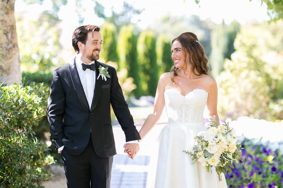 Holding hands. Loving smiles.