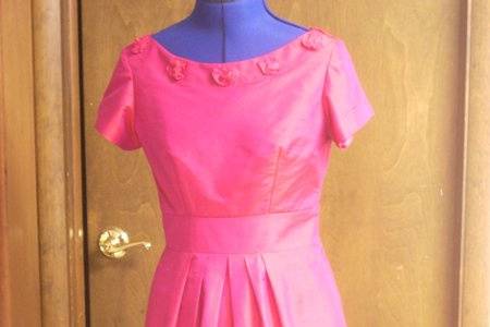 Pink silk shantung bridesmaid dress with rose details (handcrafted as well) on the neckline.