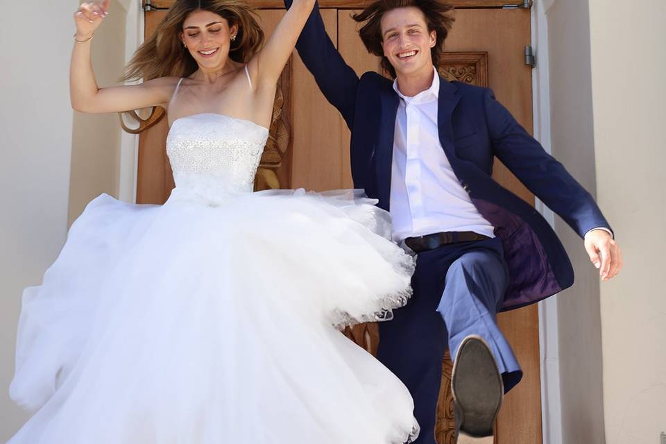 Newlyweds jump in the air
