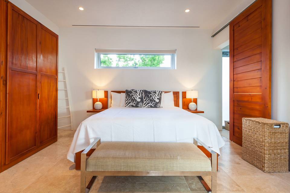 Each villa has a king bedroom on the main floor with a garden view
