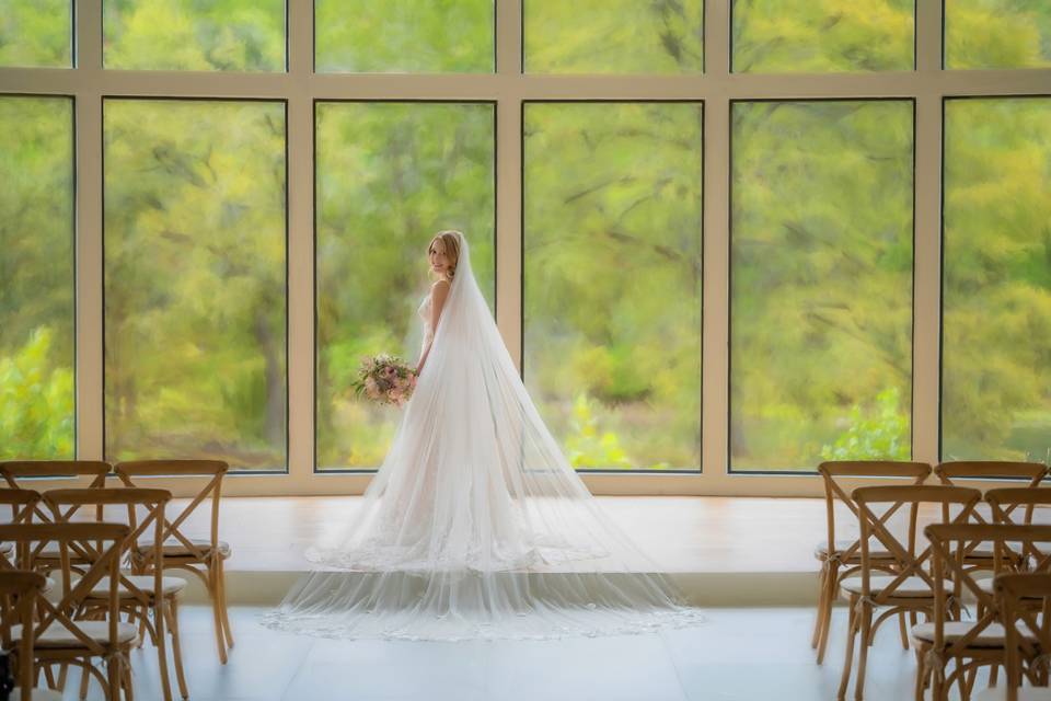 Bride in front of windows