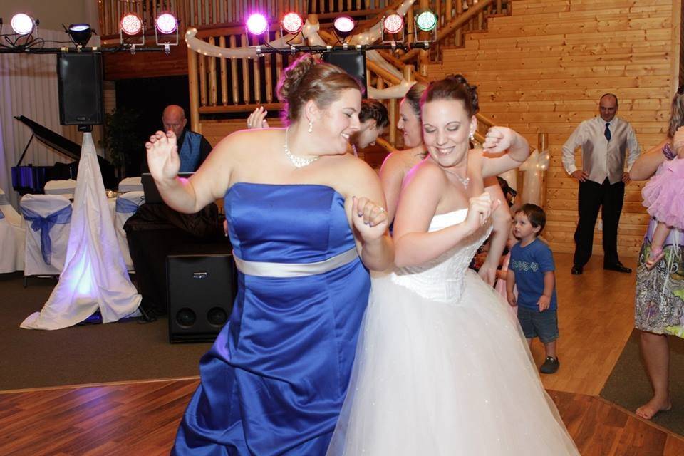 Dancing bride and bridesmaid