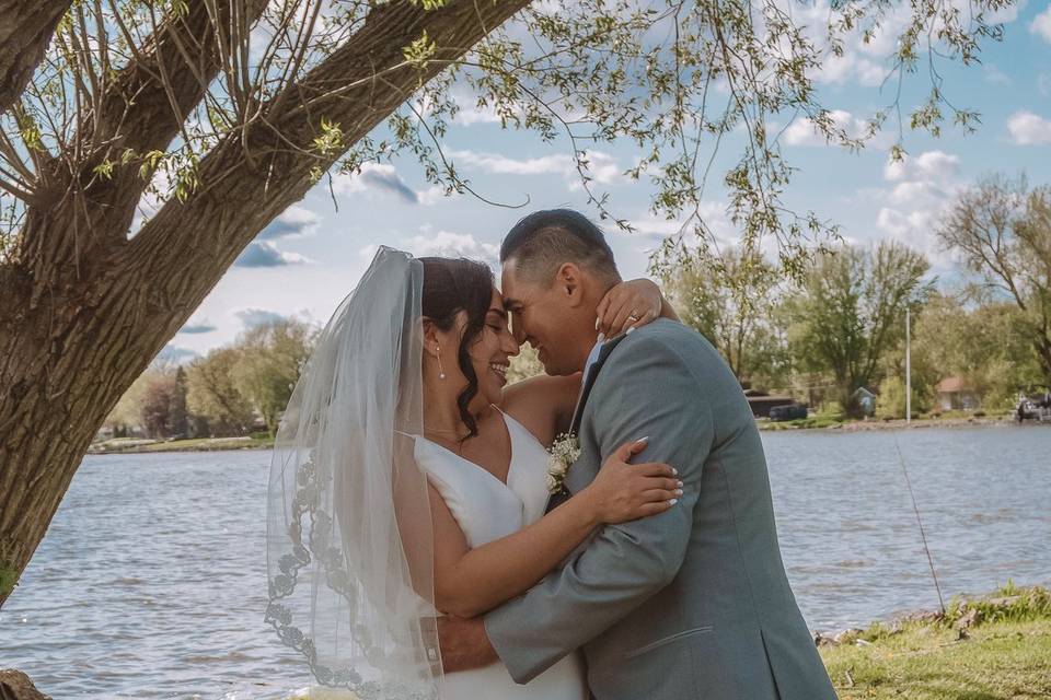 Bride and groom with lake