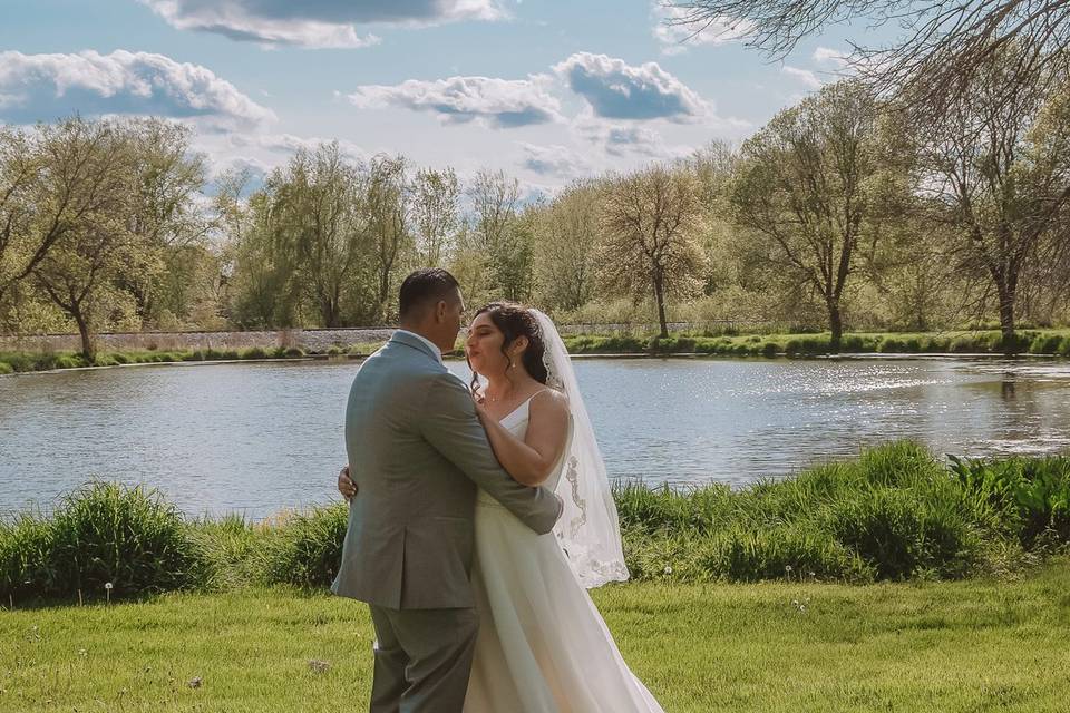 Bride and groom with lake