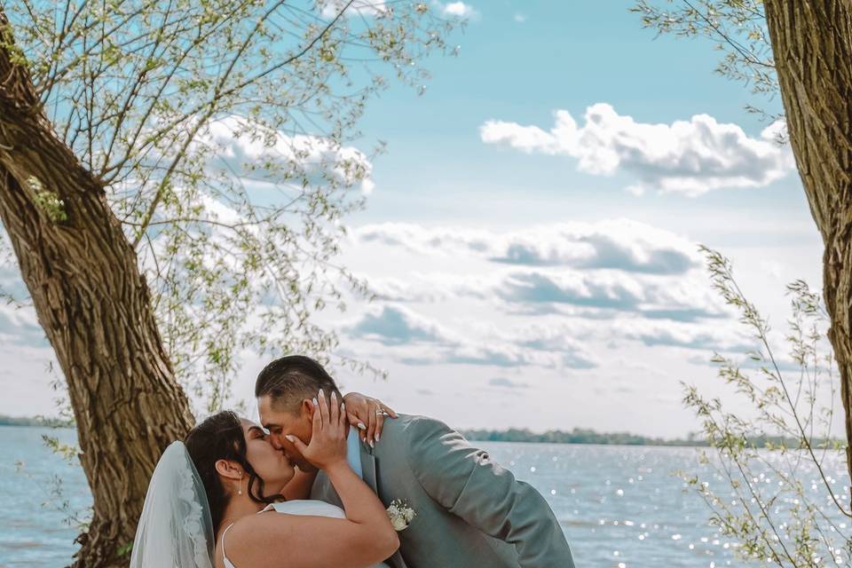 Bride and groom with lake pose