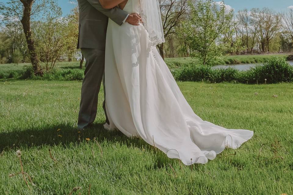 Bride and groom with lake pose