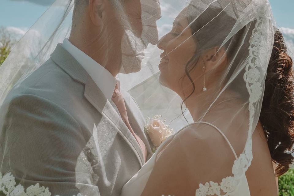 Bride and groom with veil