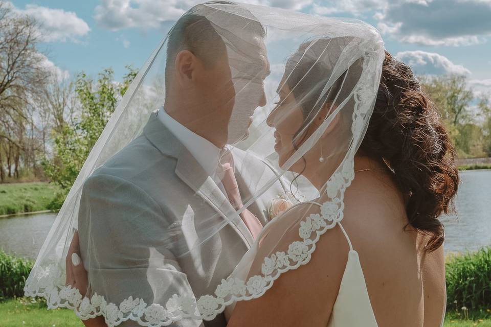 Bride and groom with veil