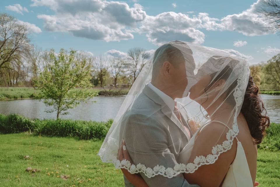 Bride and groom with veil