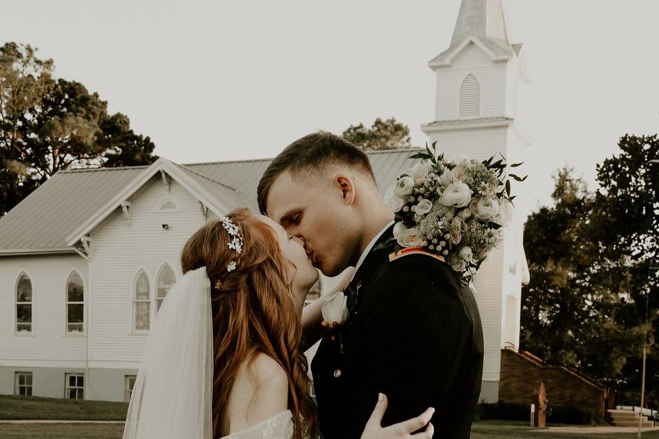 Newlyweds kissing