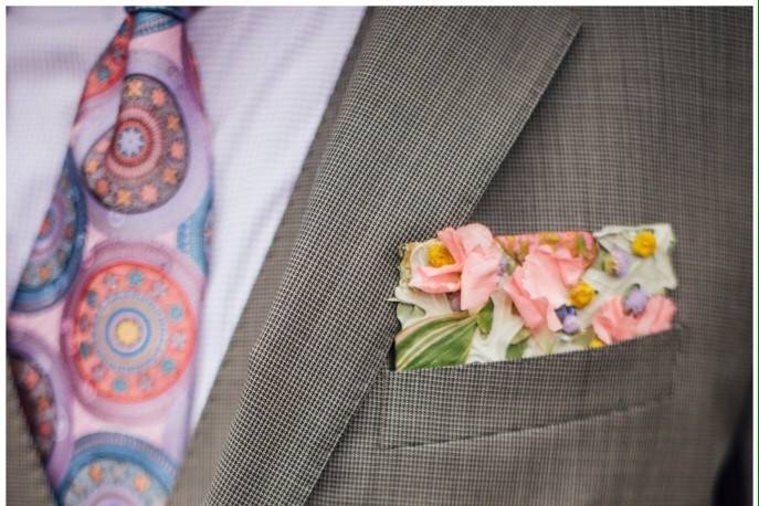 Floral pocket square in place of a more traditional boutonnière.